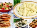 Kolorowy kolaż potraw: ryż z warzywami, kluski, naleśniki, kulki ryżowe i faszerowana cukinia.